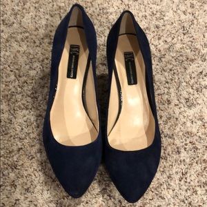 Navy blue heels warn once